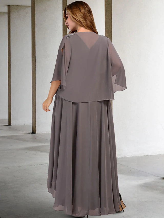 Close-up of the beaded detail on the sleeveless V-neck gown.