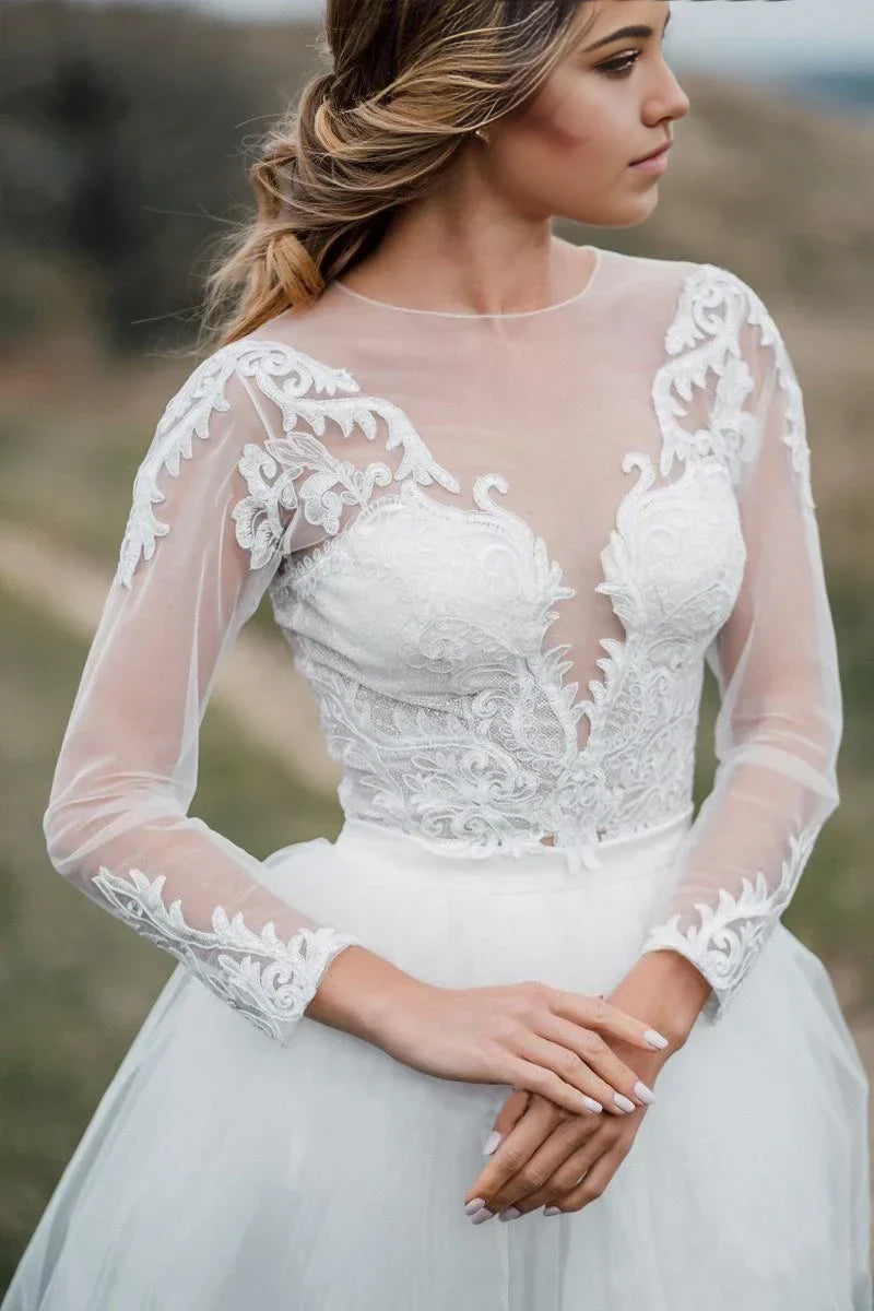 Full length view of a bride wearing a bohemian two-piece wedding dress.