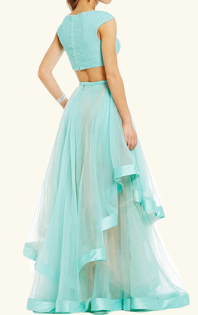 Back view of a turquoise two-piece cap sleeve tulle formal gown.