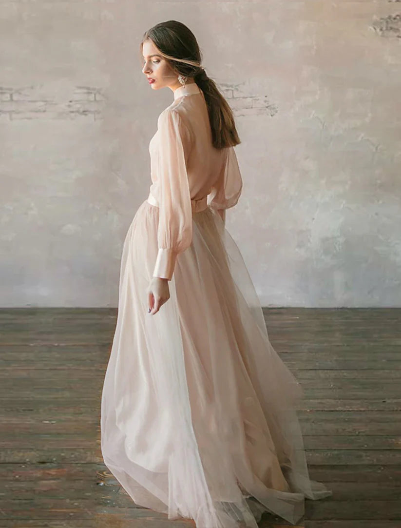 Back view of the tiered floor-length chiffon gown.