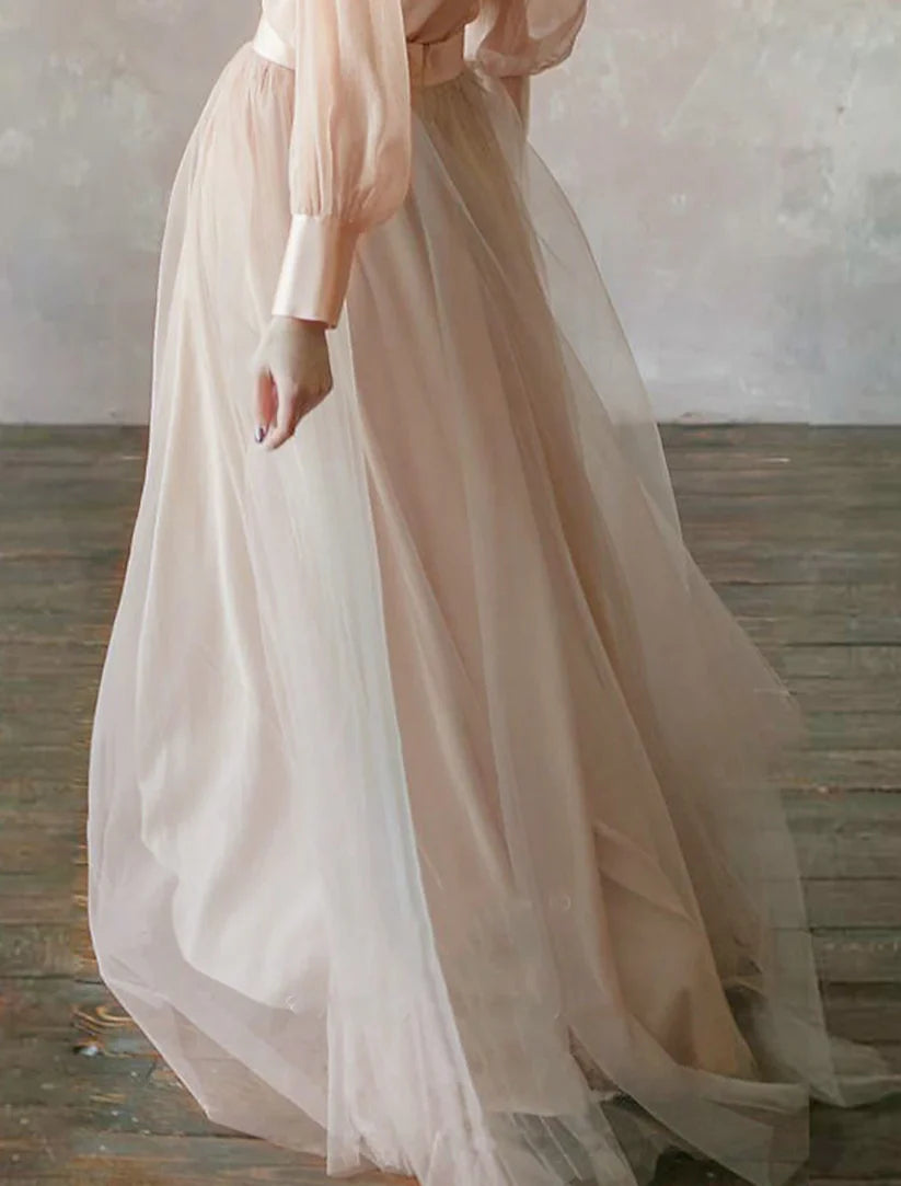 Side profile of the minimalist long sleeve formal gown.