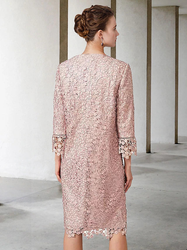 Close-up of the lace and applique details on the short sleeve jacket.