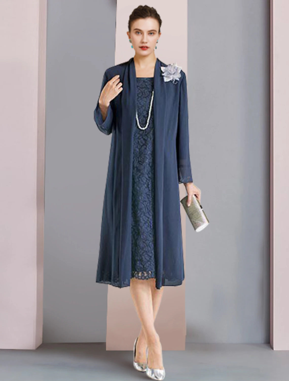 Elegant two-piece sheath dress with 3/4 sleeve lace jacket and flower detail.