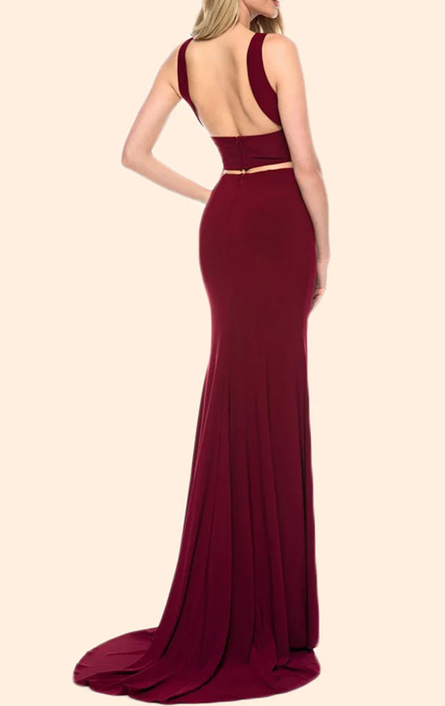 Model wearing a purple two-piece halter mermaid long prom dress.