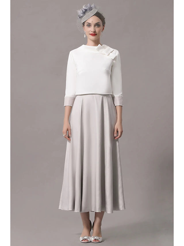 Elegant two-piece Mother of the Bride dress with jewel neck and 3/4 sleeves.