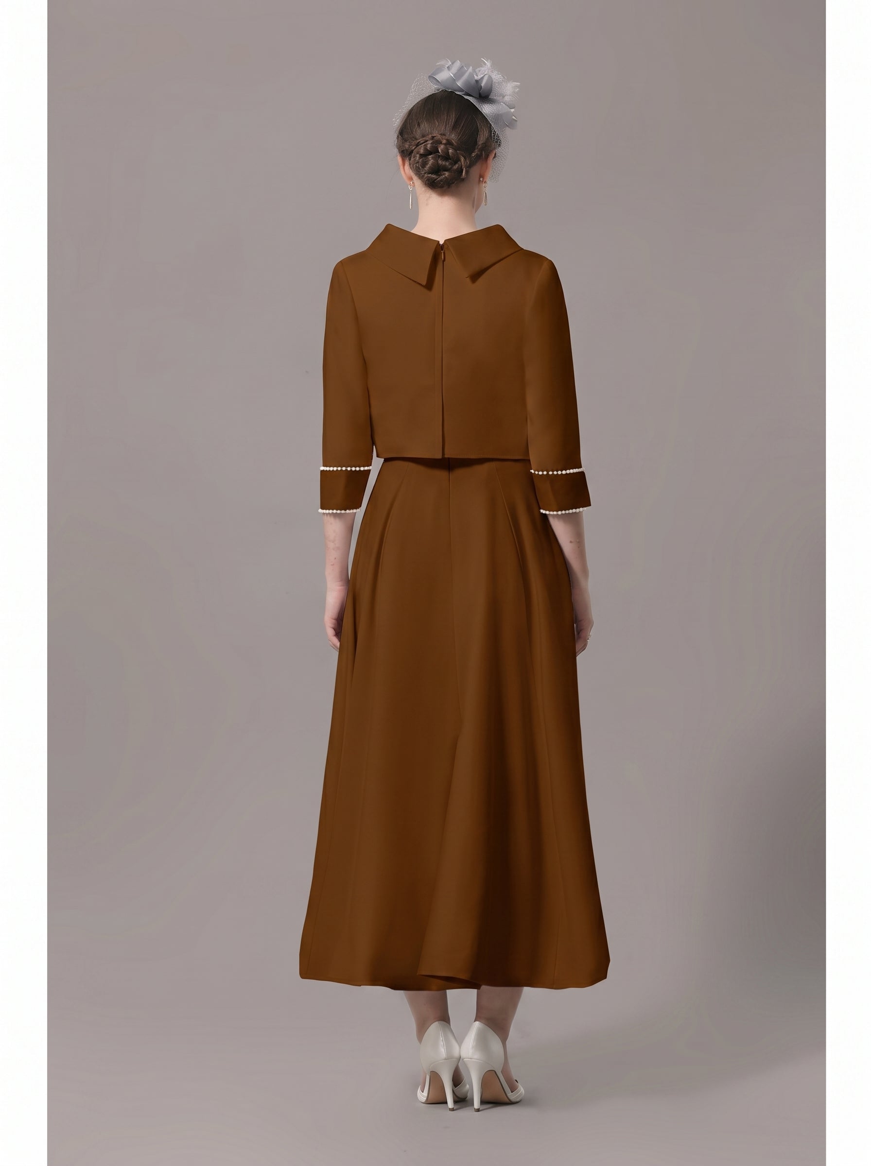 Back view of the elegant formal dress, highlighting the silhouette.
