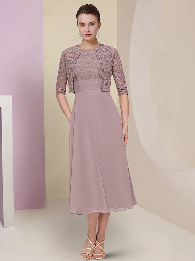 Elegant two-piece mother of the bride dress with jewel neck and half sleeves.