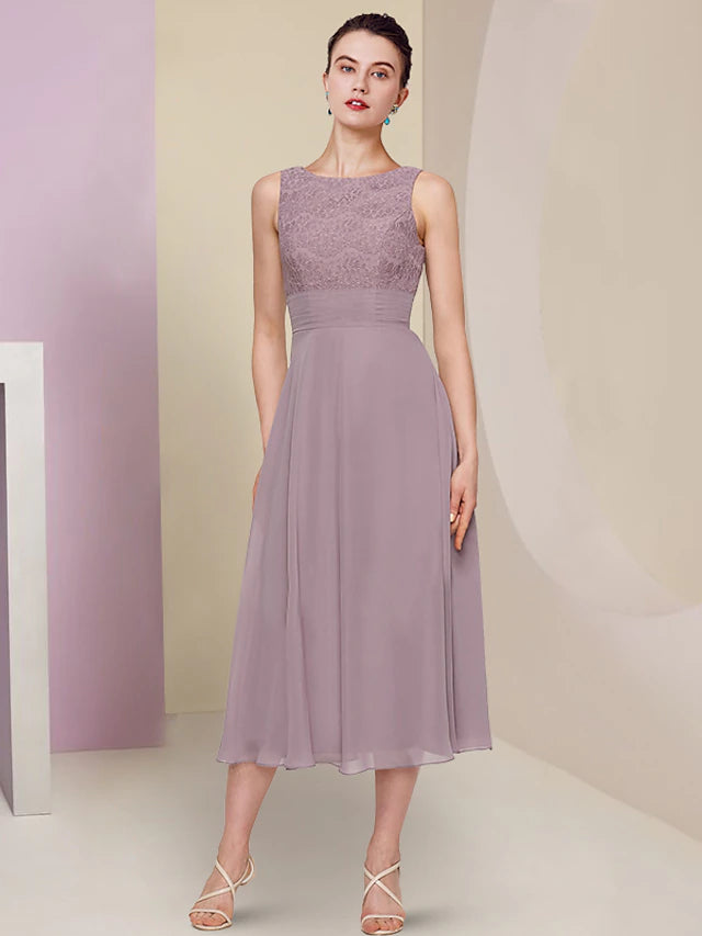 Close-up of the jewel neck and half sleeve lace detail on the dress.