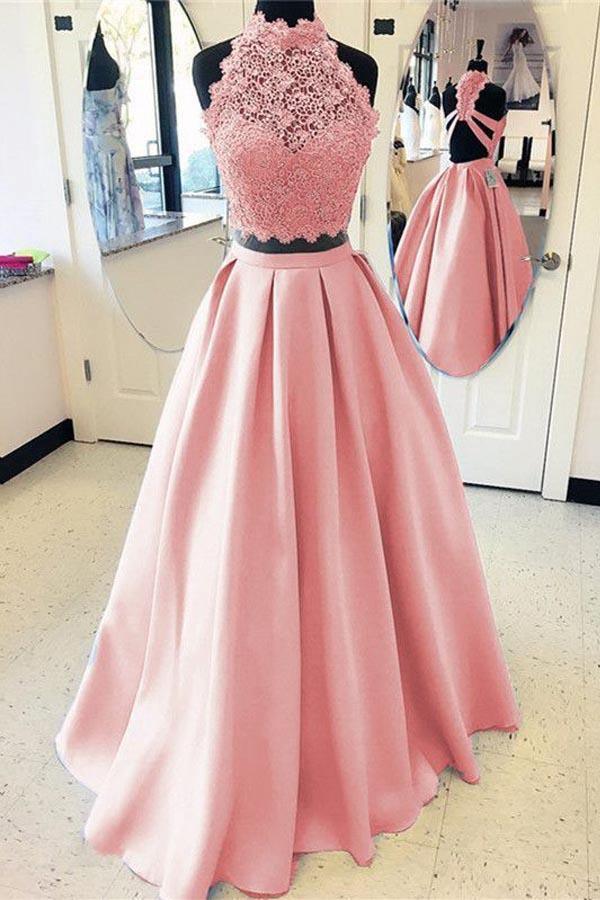 Close-up of the lace high neck top of a two-piece formal gown.