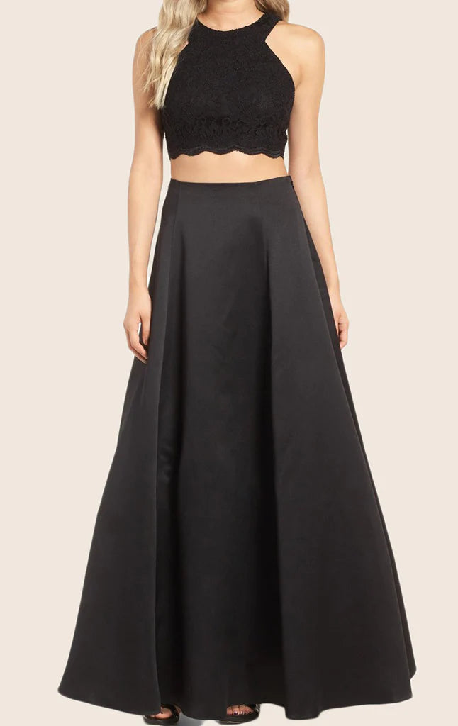Model wearing an elegant two-piece lace and satin prom gown.