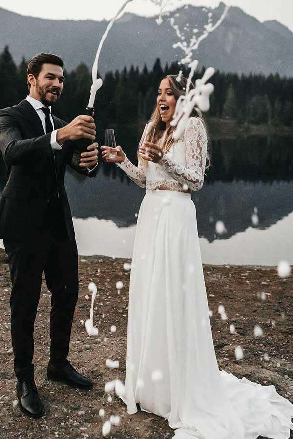 Back view of the ivory two-piece wedding dress with long sleeves.