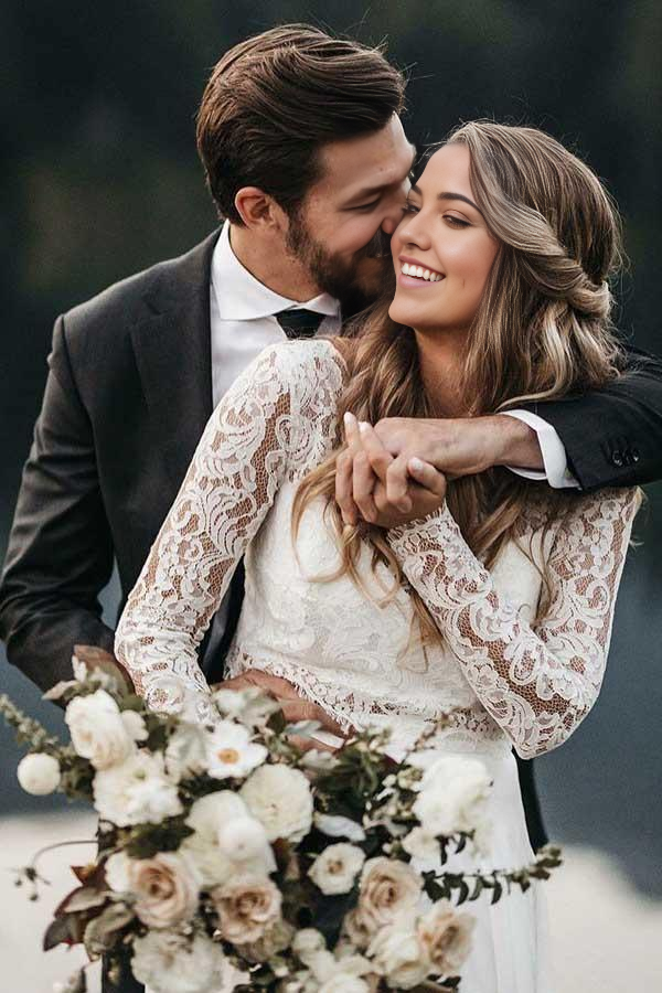 Detail of the long lace sleeves on the ivory wedding dress.