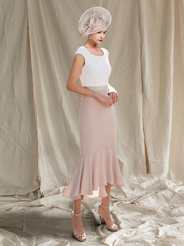 Back view of the elegant two-piece mother of the bride dress, highlighting the silhouette and jacket details.
