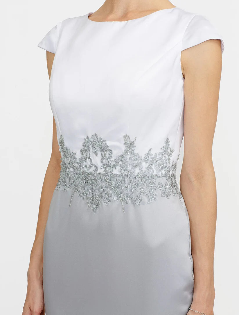 Model wearing the formal two-piece satin dress, highlighting the short sleeves.