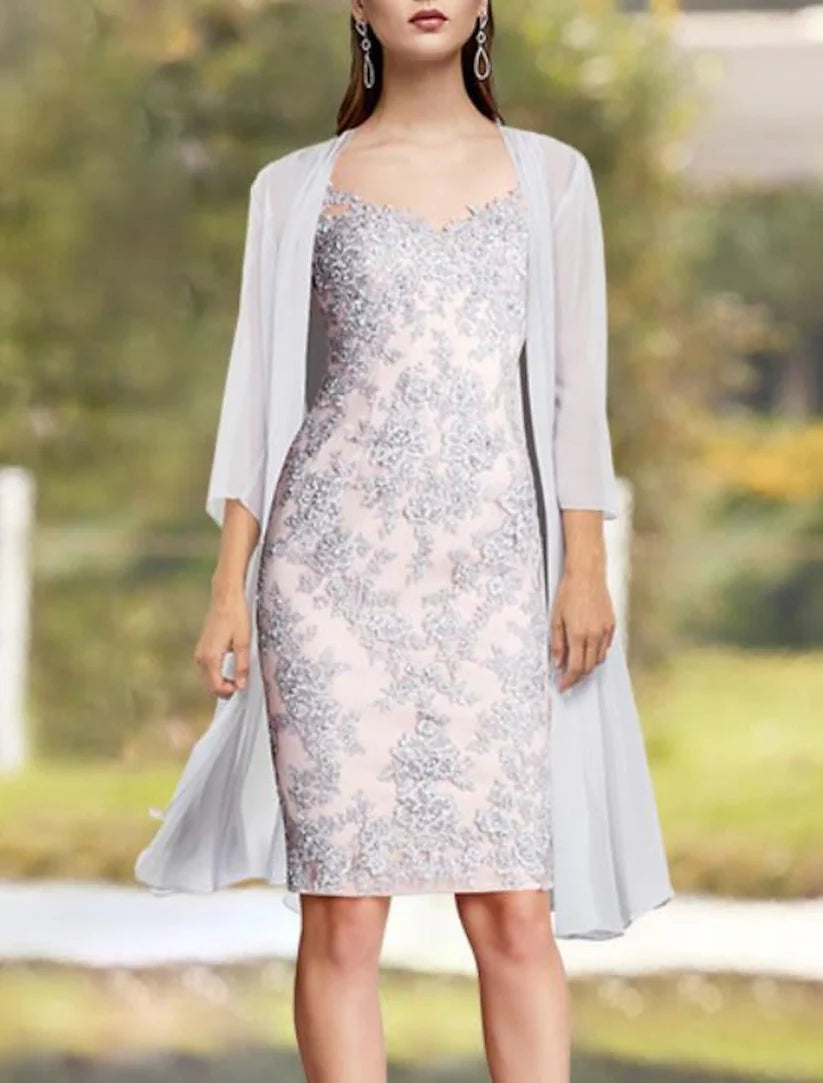 Close-up of lace appliques on the V-neckline and 3/4 sleeve jacket.