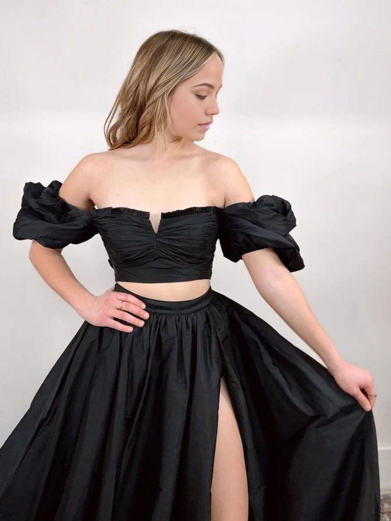 Model showcasing the two-piece off-shoulder periwinkle formal dress.