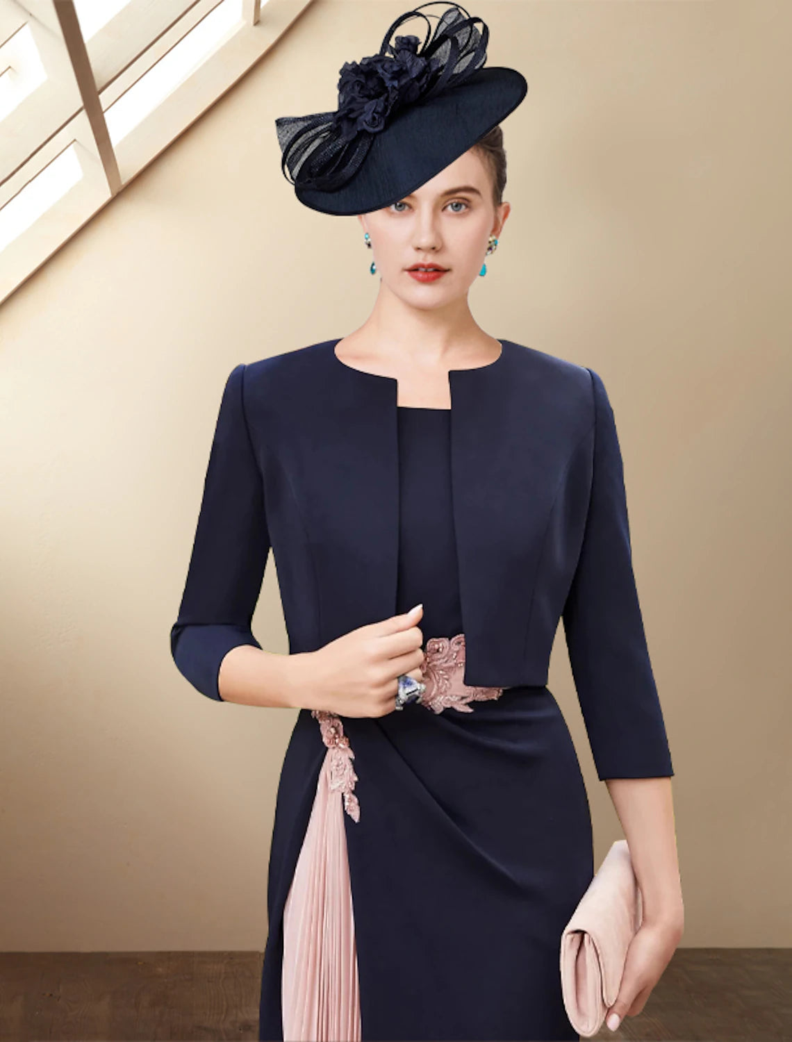 Elegant two-piece off-shoulder sheath dress with short jacket and pleats.