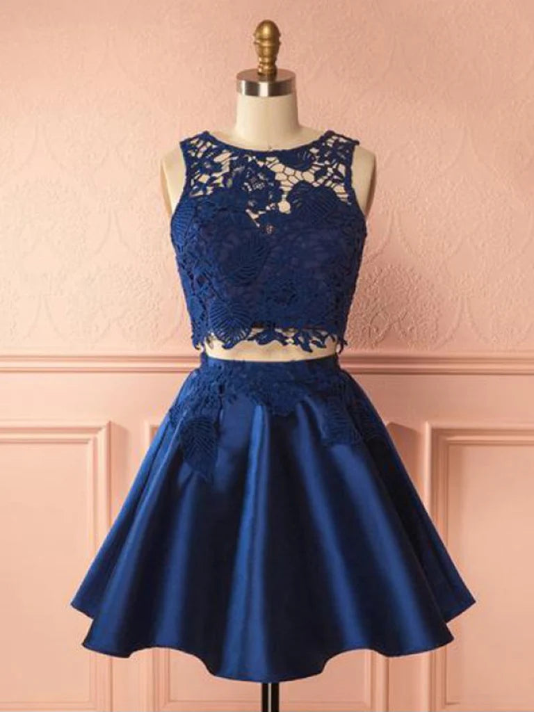 Model wearing a two-piece round neck lace short prom dress, front view.