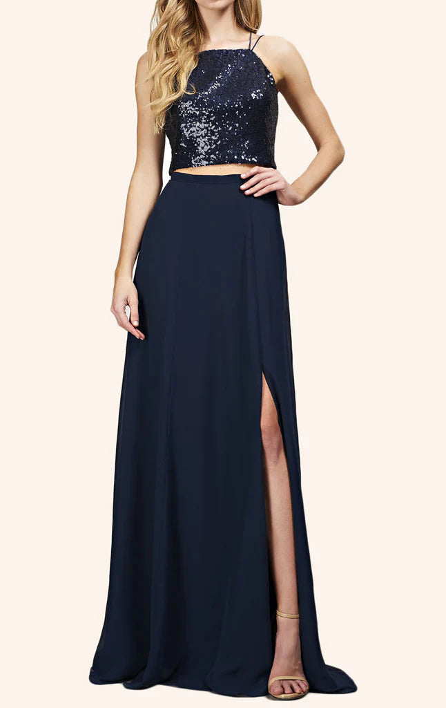 Woman wearing a two-piece sequin bodice and long chiffon skirt formal gown, front view.