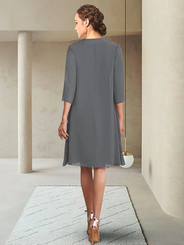 Close-up of the chiffon fabric and 3/4 sleeve jacket on the Mother of the Bride dress.