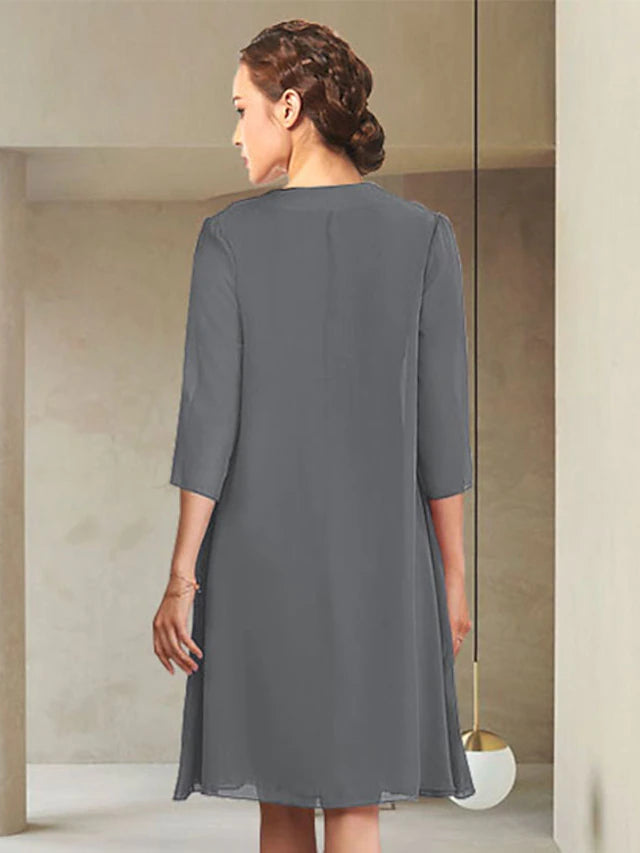 Full view of the two-piece Mother of the Bride dress, showcasing the sheath silhouette.