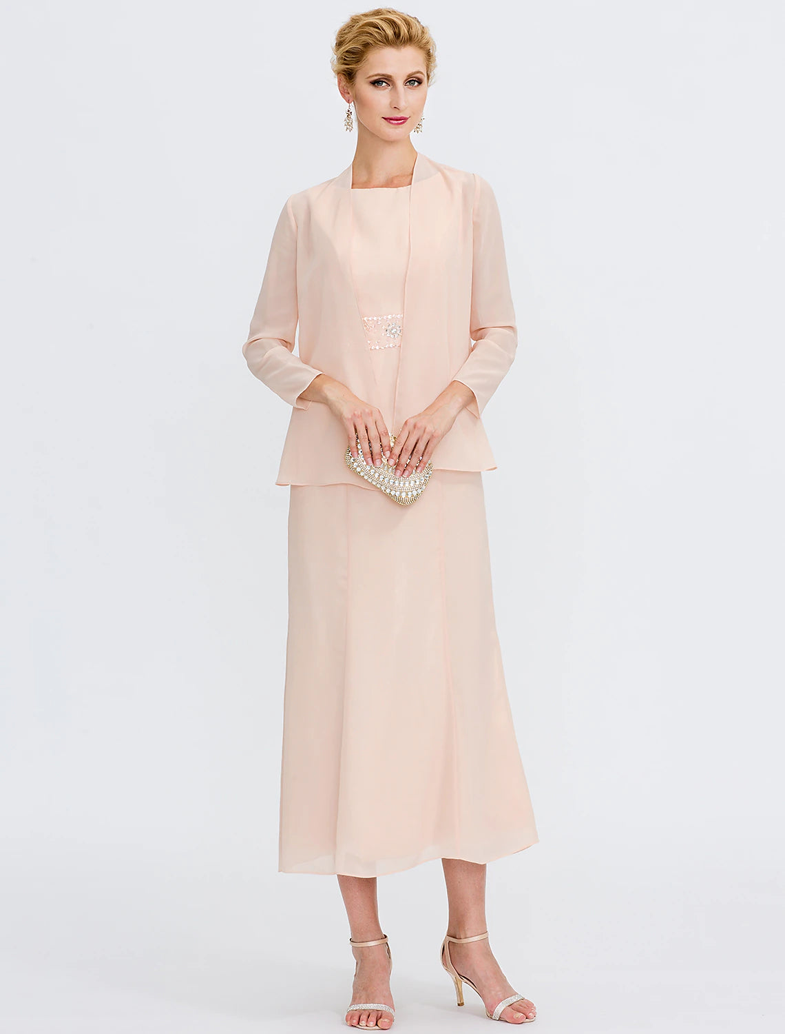 Side view of the jewel neck tea length dress with beading.