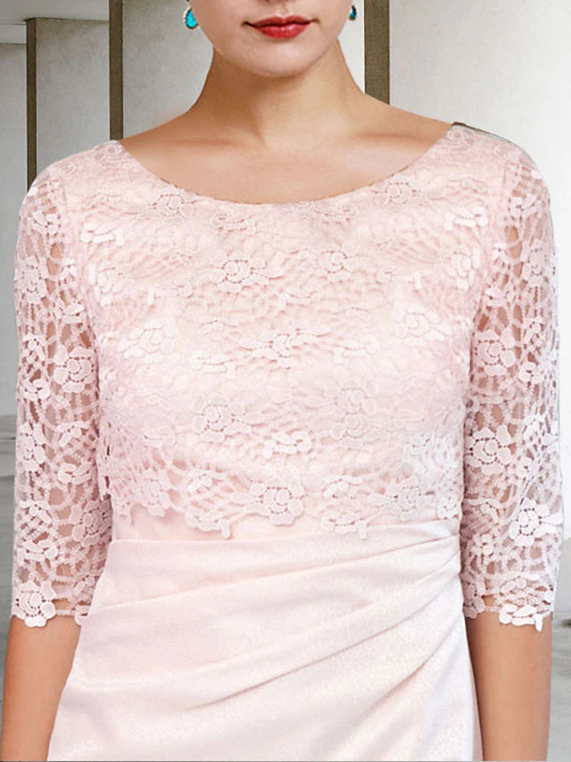 Knee-length satin and lace mother of the bride dress with side-draped detail.