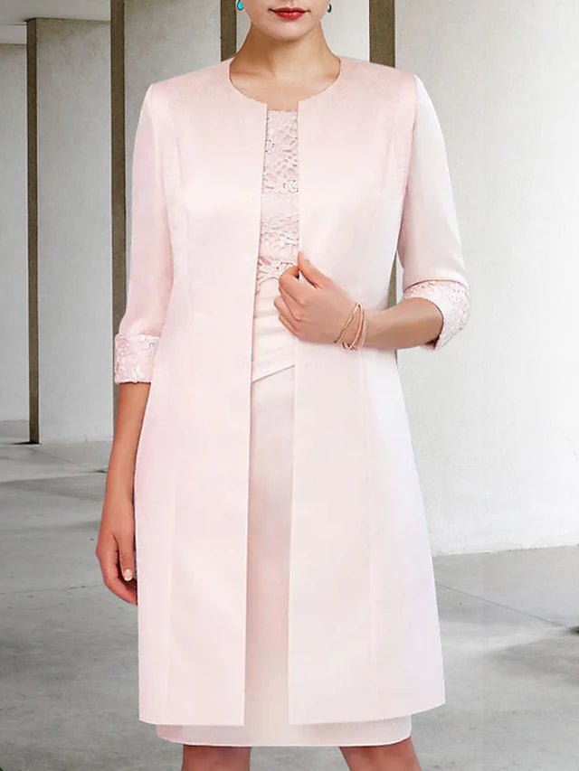 Woman wearing a sophisticated two-piece formal dress for church or wedding.