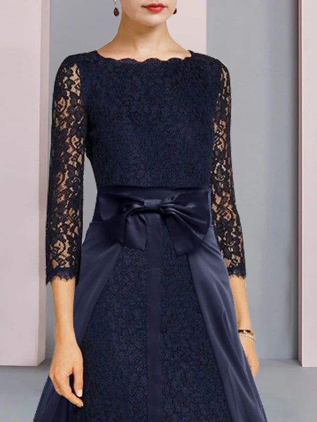 Side view of a woman showcasing the lace top and bow detail of the two-piece dress.