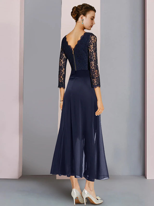 Close-up of the lace 3/4 sleeve top and scoop neck of the elegant two-piece dress.