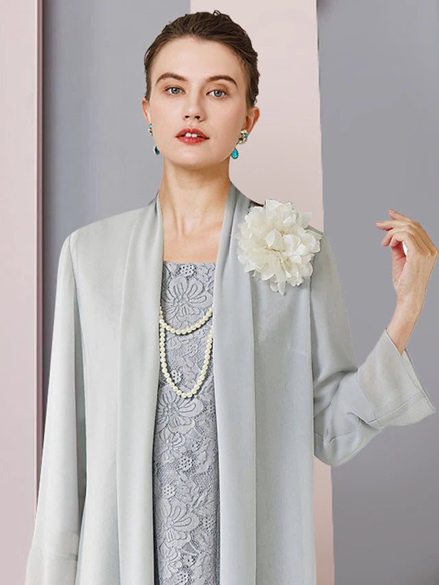 Back view of the elegant two-piece sheath mother of the bride dress, showing the tea length and jacket.