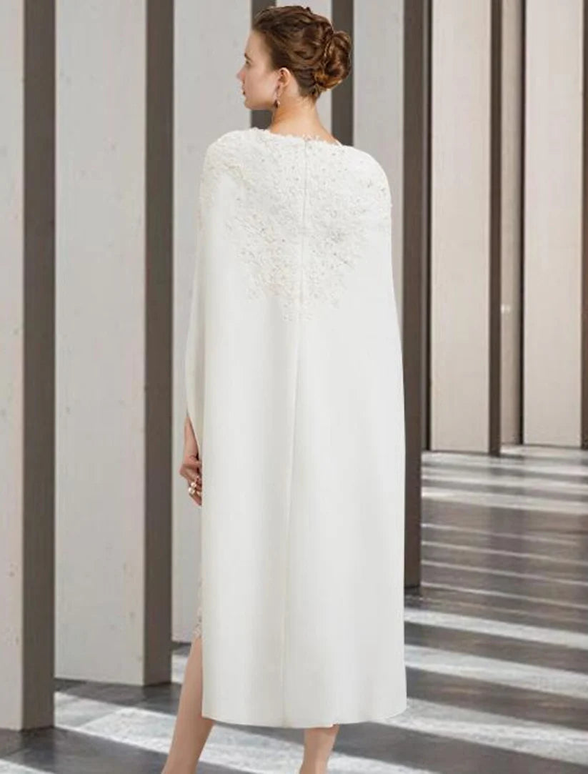 Back view of the two-piece sheath dress, highlighting the column silhouette and knee-length hem.