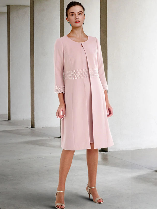 Elegant two-piece sheath Mother of the Bride dress with a beaded short-sleeve jacket and jewel neck.