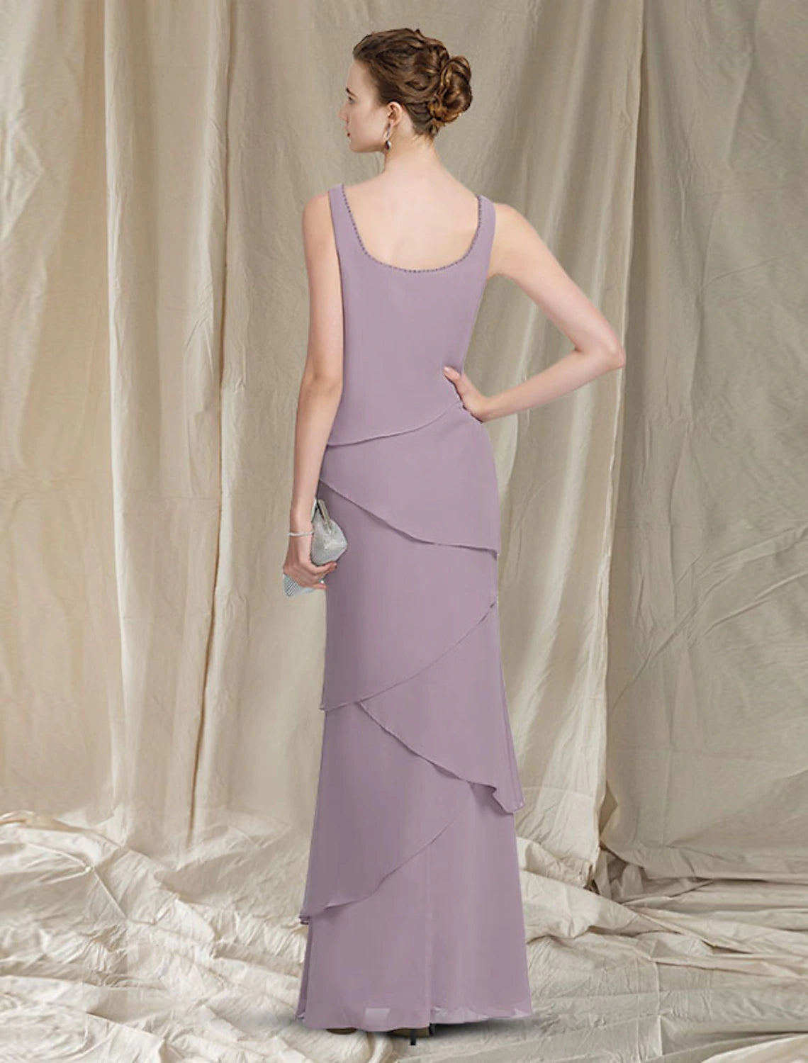 Mother of the bride dress with scoop neckline and delicate beading details.