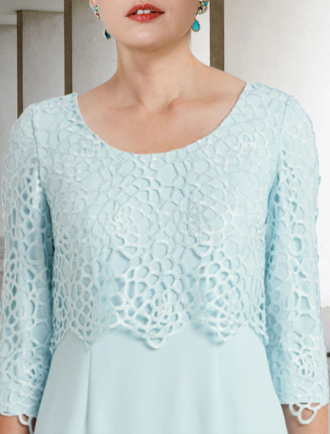 Side view of the two-piece Mother of the Bride dress, showing the jacket and knee length.