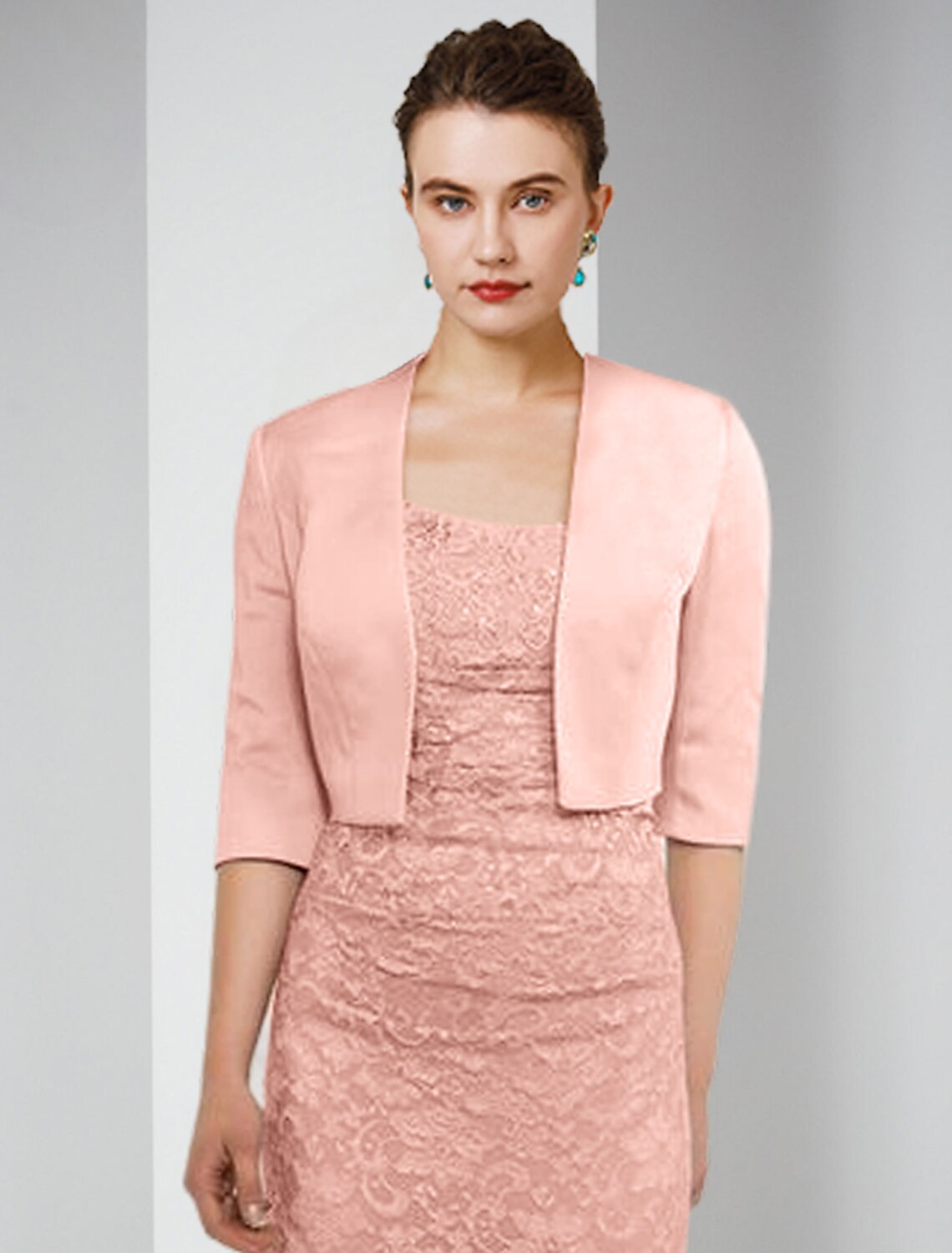 Back view of the two-piece sheath formal dress with jacket and floor-length skirt.