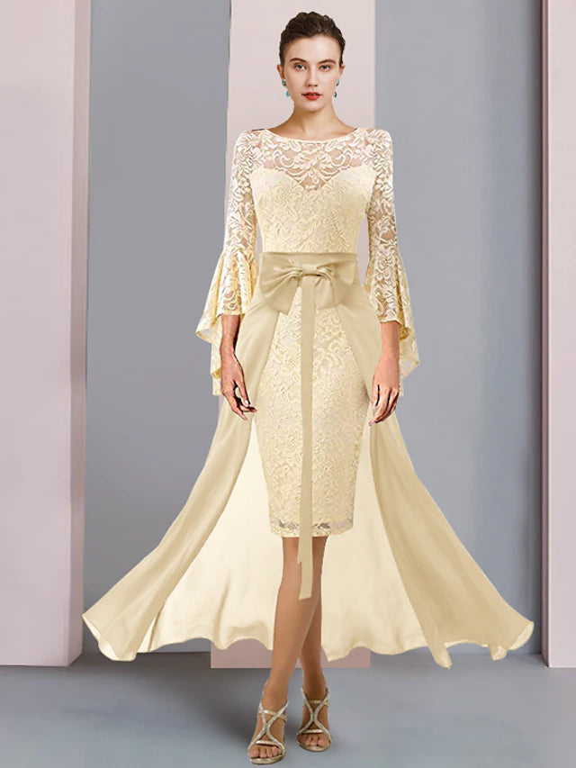 Elegant two-piece sheath dress with scoop neck and 3/4 sleeves.