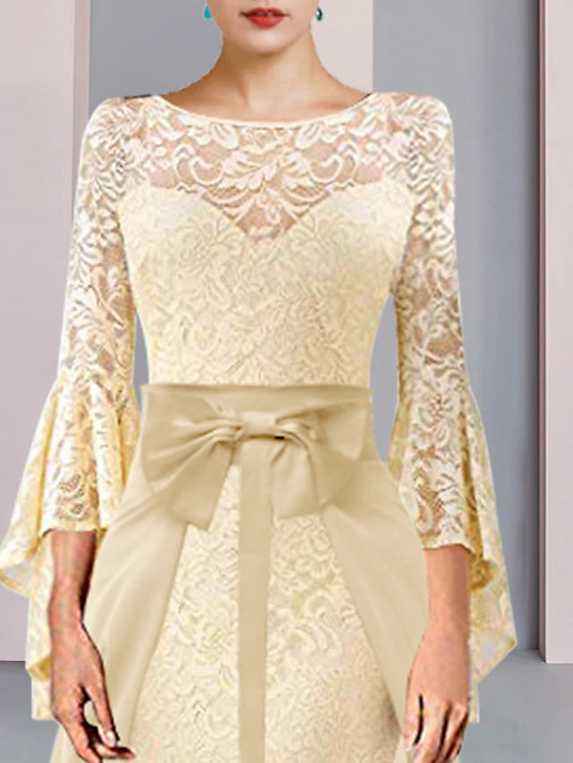 Knee-length lace and chiffon Mother of the Bride dress with bow detail.