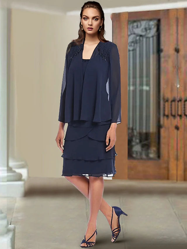 Elegant two-piece mother of the bride dress with scoop neck and beading.