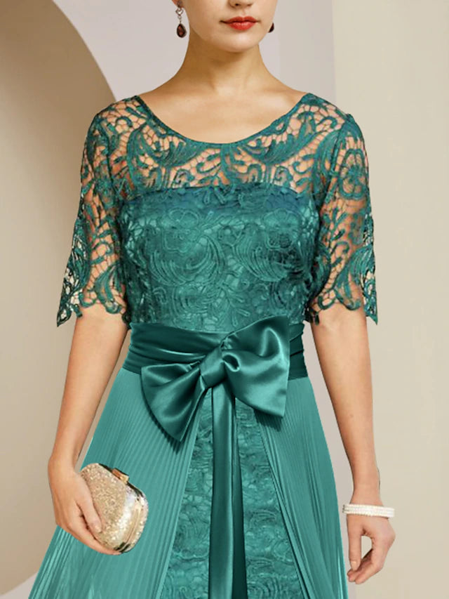 Formal knee-length two-piece dress for wedding guests.