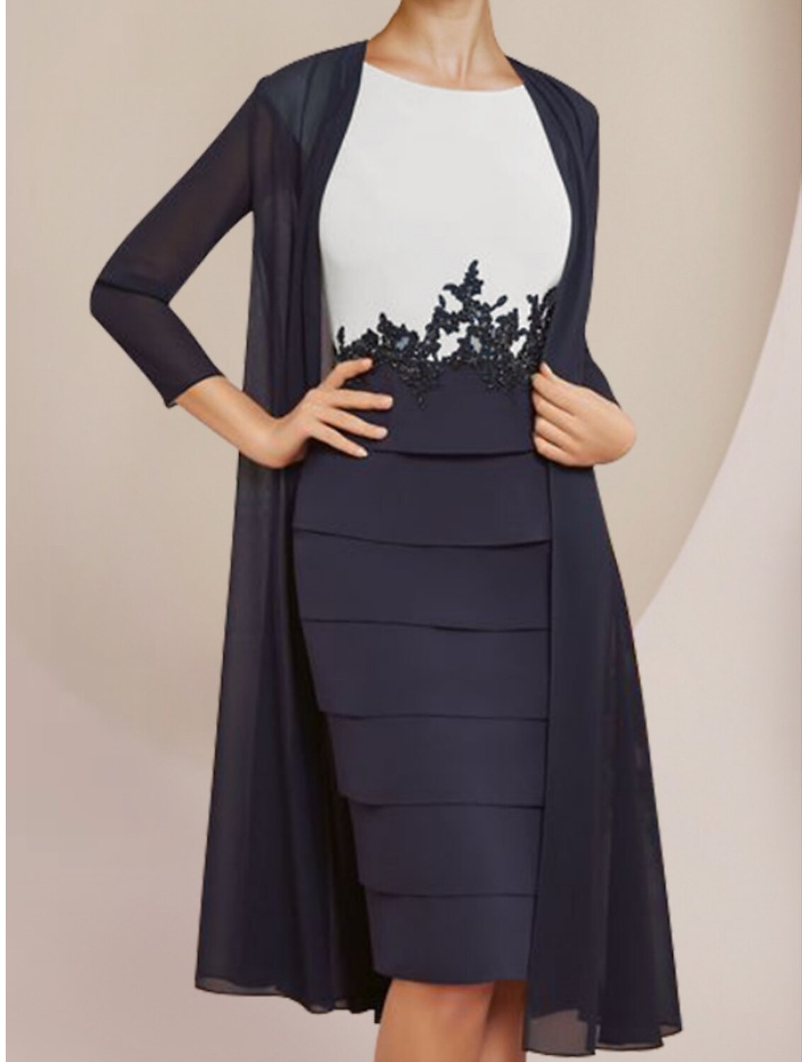 Back view of the two-piece chiffon and lace dress with ruching details.