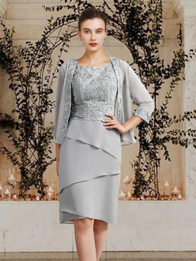 Detail of the delicate lace appliques and ruffled wrap included with the Mother of the Bride dress.