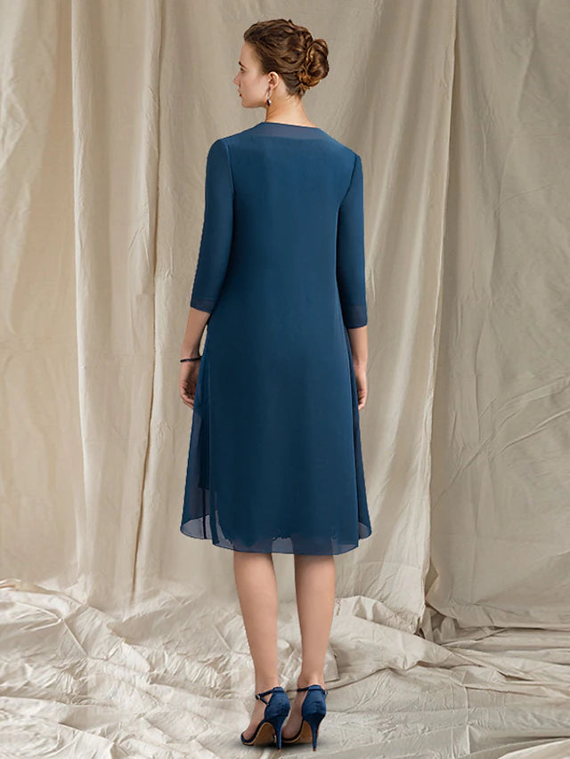 Side view of the knee-length sheath dress, showing the elegant silhouette.