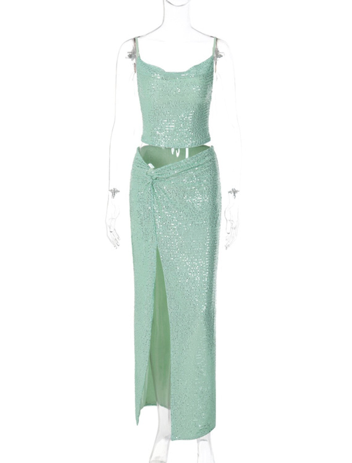 Close-up of the sequin detailing on the two-piece party dress worn by a model.