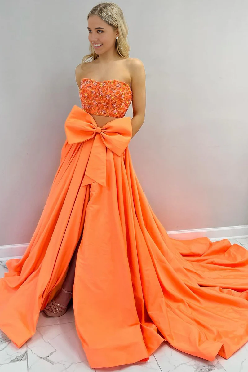 Side view of yellow two-piece strapless satin long prom dress.