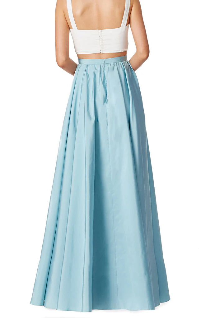 Back view of the two-piece satin formal gown with delicate straps.