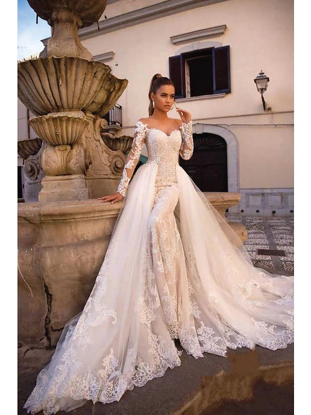 Side view of a long sleeve sweetheart wedding dress with delicate details.