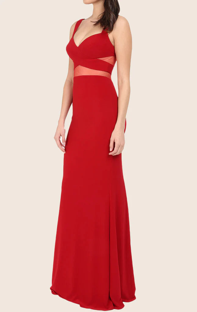 Back view of a two-piece mermaid formal gown with a flowing train.