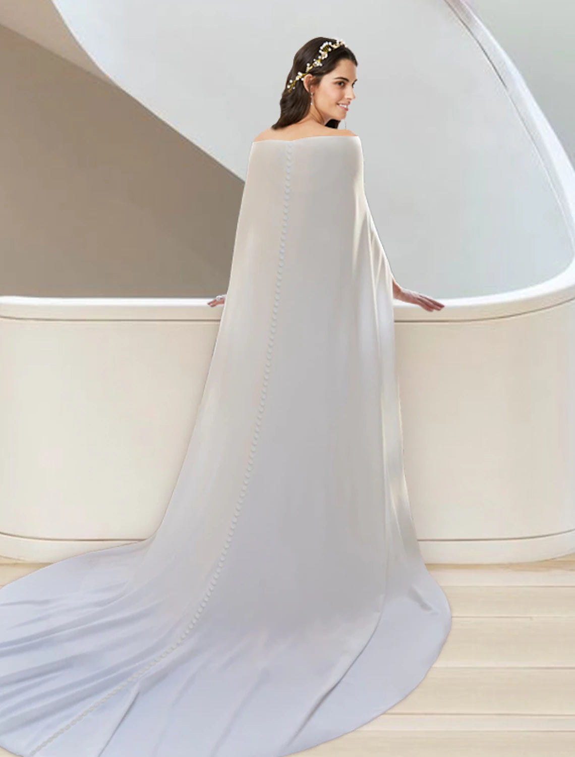 Full length view of the two-piece bridal gown with a flowing court train.