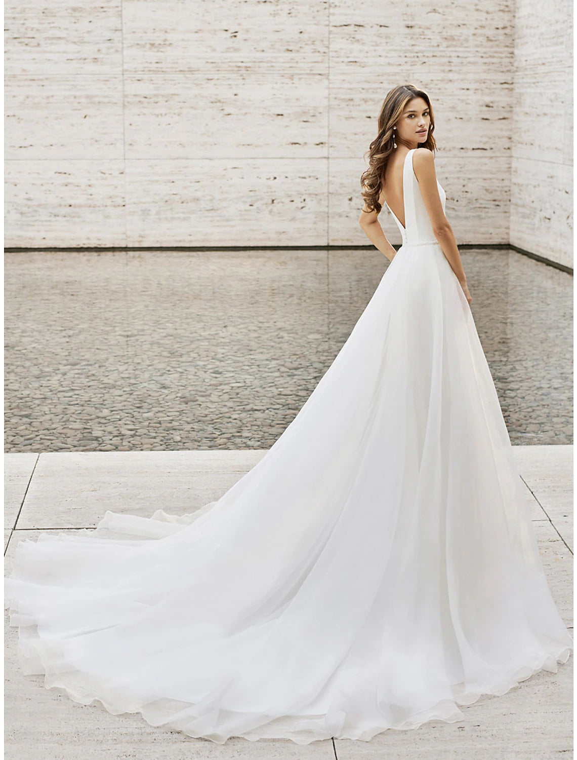 Back view of the two-piece V-neck sleeveless satin A-line beach wedding dress.